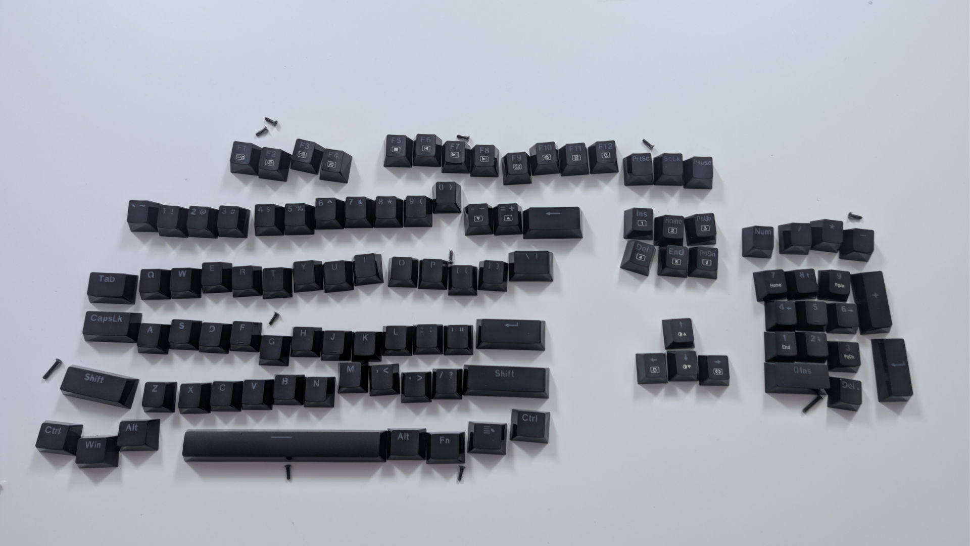 Keys with screws next to them.